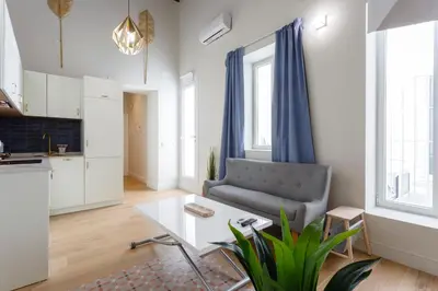 a living room with a couch and a table at Casa Manuel de Falla by Cadiz4Rentals in Cádiz