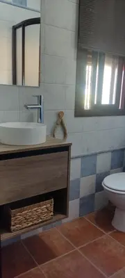 a bathroom with a sink and a toilet at Las Vistas in Arcos de la Frontera
