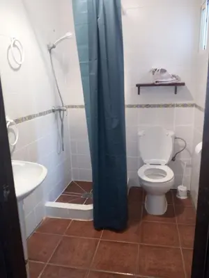 a bathroom with a toilet and a sink at Casa Marisa in Conil de la Frontera