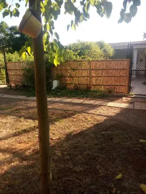 a pole with a light on it next to a fence at Casa Marisa in Conil de la Frontera