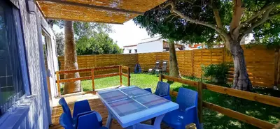 a blue table and chairs on a patio at Apartamento Mery Oliva in Chiclana de la Frontera