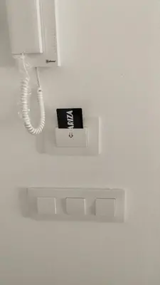 a phone and a box on a wall at Apartamento La Albariza in Jerez de la Frontera