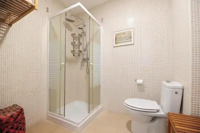 a bathroom with a shower and a toilet in it at Atico Brisa in Cádiz