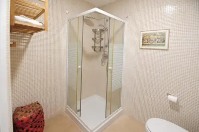 a shower stall in a bathroom with a toilet at Atico Brisa in Cádiz