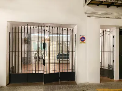 a door with a gate in a building at Casa Sanlucar Centro in Sanlúcar de Barrameda