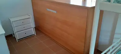 a bathroom with a wooden cabinet and a sink at PINZAPO in El Puerto de Santa María