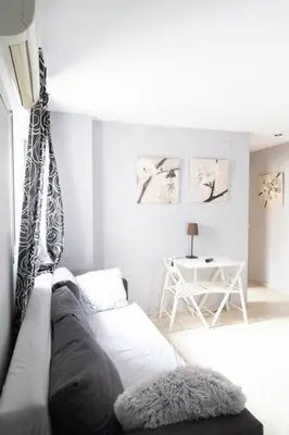 a living room with a couch and a table at Pasquín in Cádiz