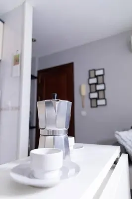 a cup and aucer on a counter in a kitchen at Pasquín in Cádiz