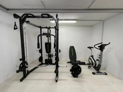 a gym with three exercise bikes in a room at Apartamentos Playa Victoria - by Grupo Tribu in Cádiz