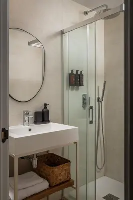 a bathroom with a sink and a shower at BYPILLOW Casa Gades in Cádiz