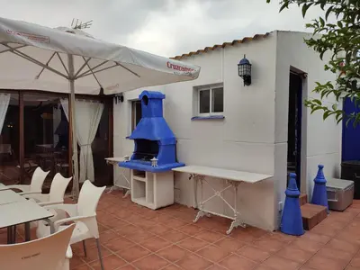 a building with a blue object on a patio at EL RETIRO in Sanlúcar de Barrameda