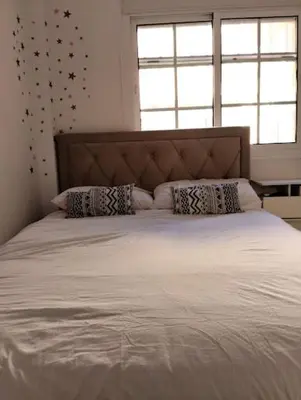 a bedroom with a large white bed with pillows at Villa Lago Golf, 300m construidos in Jerez de la Frontera