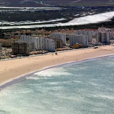 an aerial view of a beach with buildings and the ocean at Villa Lago Golf, 300m construidos in Jerez de la Frontera
