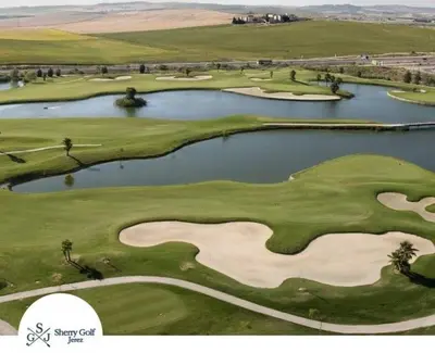an aerial view of a golf course with two reservoirs at Villa Lago Golf, 300m construidos in Jerez de la Frontera
