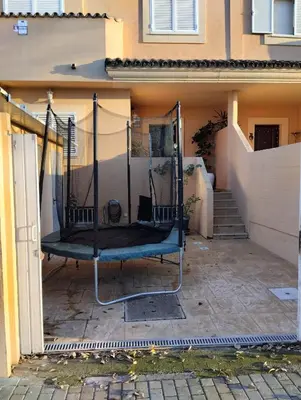 a swing in the courtyard of a house at Villa Lago Golf, 300m construidos in Jerez de la Frontera