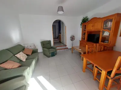 a living room with a couch and a table at La Almadraba in Novo Sancti Petri