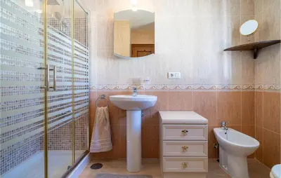a bathroom with a sink and a toilet and a shower at Gorgeous Home In Chiclana De La Fronter in Chiclana de la Frontera