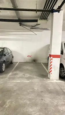 a parking garage with two cars parked in it at Puerto Barrio Alto in El Puerto de Santa María