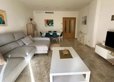 a living room with a couch and a table at Costa Ballena Mar Abierto in Costa Ballena