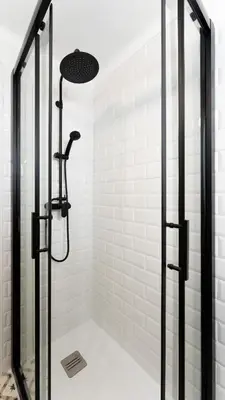 a shower with a glass door in a bathroom at La Casita Beneroso in Alcalá de los Gazules