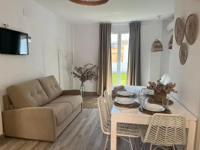 a living room with a couch and a table at Estudios Los Sueños de Ana in Jerez de la Frontera