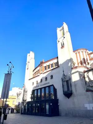 a large white building with a clock tower at Apartamentos La Albariza Jerez Centro in Jerez de la Frontera