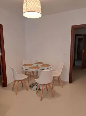 a dining room with a table and chairs at Centro de Sanlúcar, La Plata 23 in Sanlúcar de Barrameda