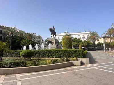 a statue of a horse on a fountain in a street at Casa Nuna Modern Loft with Private Garden Terrace in Jerez de la Frontera
