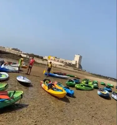 a group of boats on a sandy beach at Villa El Bomberito in Chiclana de la Frontera