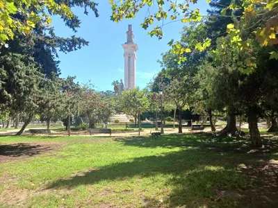 a park with a clock tower in the background at Habitación privada con baño. in Cádiz
