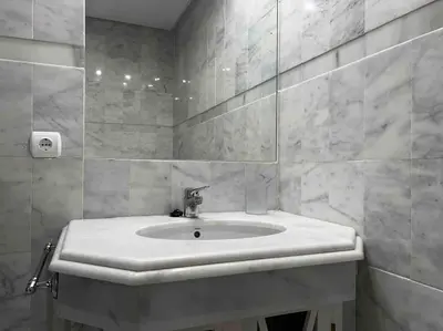 a white bathroom with a sink and a mirror at GINVA - Costa Ballena & Playa del Infante in Chipiona