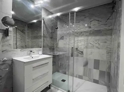 a bathroom with a shower and a sink at GINVA - Costa Ballena & Playa del Infante in Chipiona