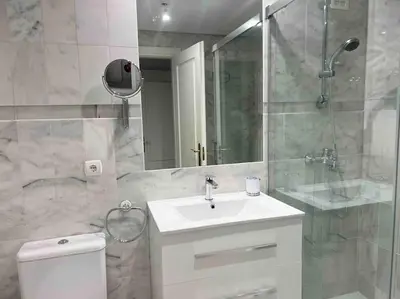 a bathroom with a toilet and a sink and a shower at GINVA - Costa Ballena & Playa del Infante in Chipiona