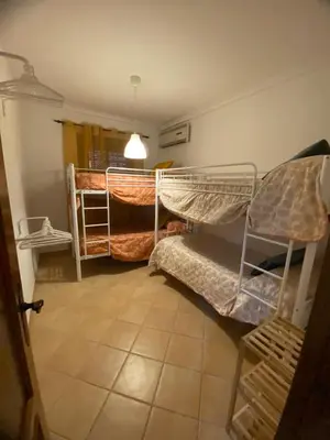 a room with two bunk beds in a room at Chalet La Garrocha in Chiclana de la Frontera