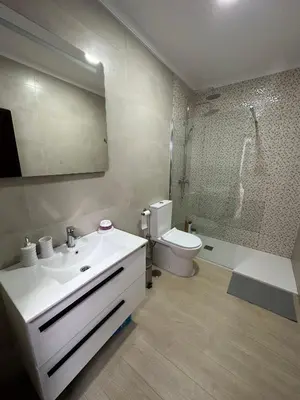 a bathroom with a sink and a toilet and a shower at Chipiona Suites A in Chipiona