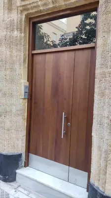 a wooden door on a building with a window at Tanguillo by Gades Gestión in Cádiz