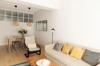 a living room with a couch and a table at Tanguillo by Gades Gestión in Cádiz