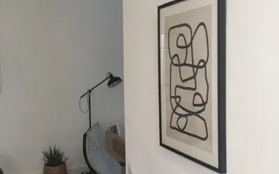 a picture on a wall next to a lamp at Tanguillo by Gades Gestión in Cádiz