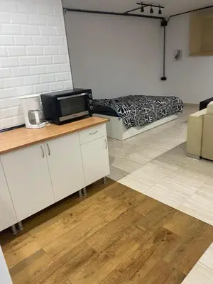 a room with a bed in the corner of a room at MiaEle in Sanlúcar de Barrameda