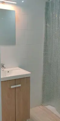 a bathroom with a sink and a shower at MiaEle in Sanlúcar de Barrameda