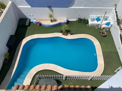 an overhead view of a swimming pool on a roof at Apartamento in Sanlúcar de Barrameda