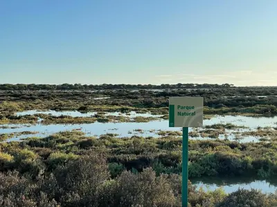 a sign in the middle of a field at La Marciana - piscina pista tenis futbol y baloncesto privado - Bungalow externo independiente in Chiclana de la Frontera