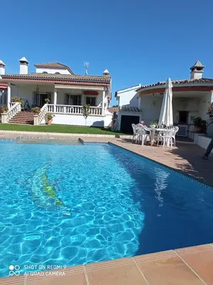 a swimming pool in front of a house at Casa Mirador del Lago in Arcos de la Frontera