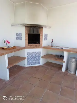 a kitchen with a fireplace in a room at Casa Mirador del Lago in Arcos de la Frontera