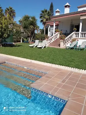 a swimming pool in front of a house at Casa Mirador del Lago in Arcos de la Frontera