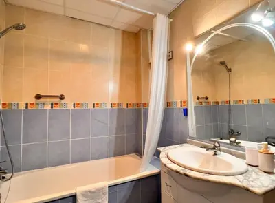 a bathroom with a sink and a tub and a shower at SibsSanlucar Carril SanDiego Centro Familias Garaje in Sanlúcar de Barrameda