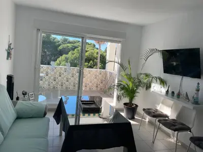 a living room with a couch and a glass table at Apartamento Rota in Rota
