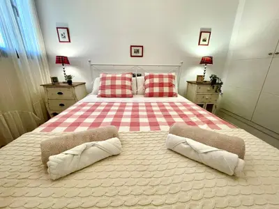 a bedroom with a large bed with two pillows at GATU PREMIUM La Brisa 