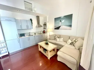 a living room with a couch and a table at GATU PREMIUM La Brisa 
