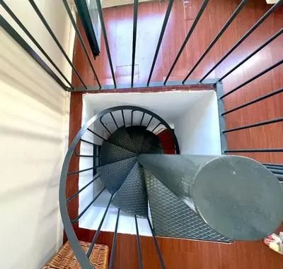 a spiral staircase in a building with a metal object at GATU PREMIUM La Brisa 